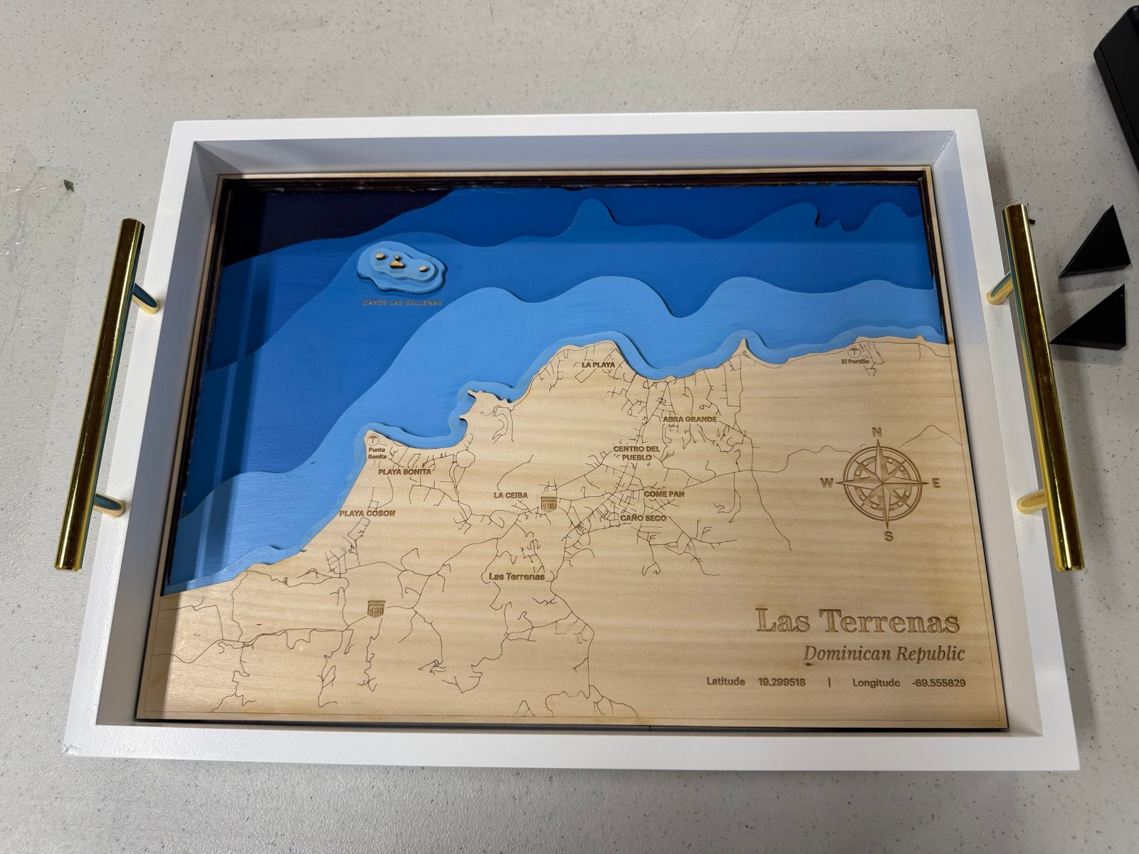 Las Terrenas wooden map with an engraved compass rose and coordinates